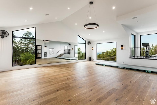4155 S Parkview Dr, Salt Lake City, UT 84124 - unfurnished living room with high vaulted ceiling, recessed lighting, and light wood-style floors