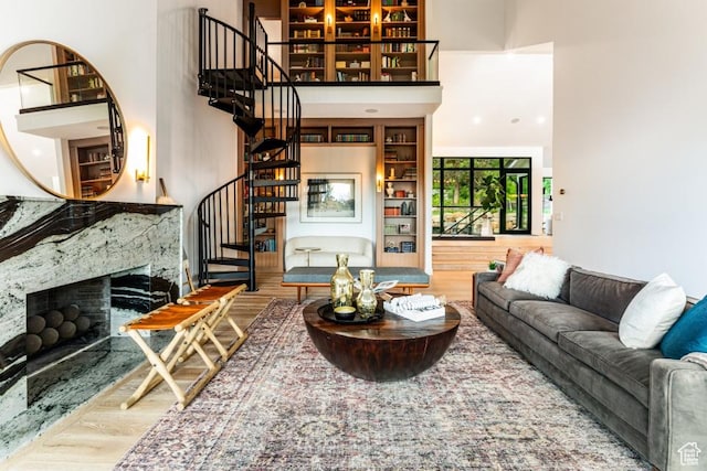 4155 S Parkview Dr, Salt Lake City, UT 84124 - living room with stairway, a towering ceiling, wood finished floors, and a fireplace