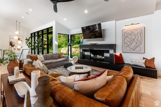 4155 S Parkview Dr, Salt Lake City, UT 84124 - living area with ceiling fan, high vaulted ceiling, recessed lighting, wood finished floors, and a brick fireplace