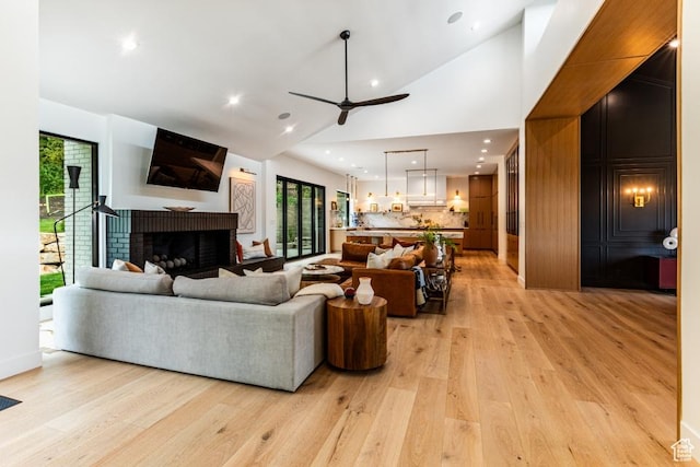 4155 S Parkview Dr, Salt Lake City, UT 84124 - living room with high vaulted ceiling, a ceiling fan, recessed lighting, a brick fireplace, and light wood finished floors