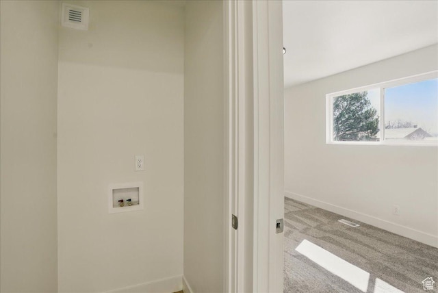laundry room with carpet, visible vents, baseboards, and hookup for a washing machine