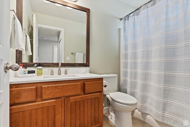bathroom featuring toilet, curtained shower, and vanity