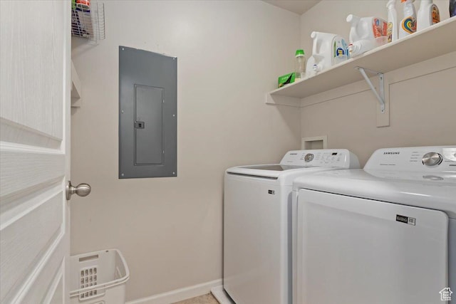 laundry area featuring laundry area, independent washer and dryer, electric panel, and baseboards