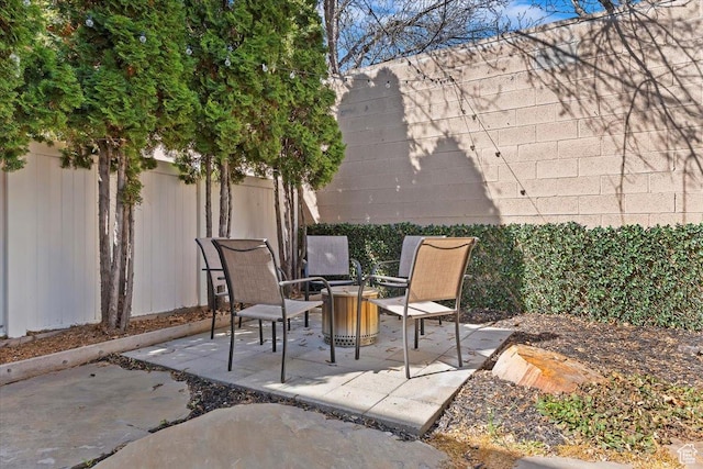 view of patio / terrace featuring fence