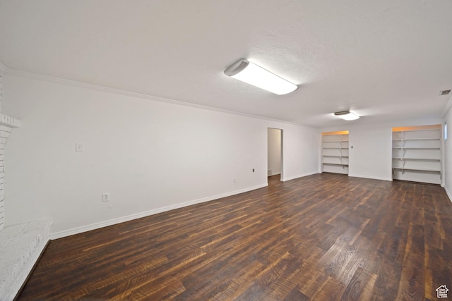 interior space featuring built in features, ornamental molding, visible vents, baseboards, and dark wood-style floors