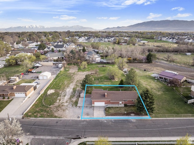 drone / aerial view featuring a mountain view and a residential view