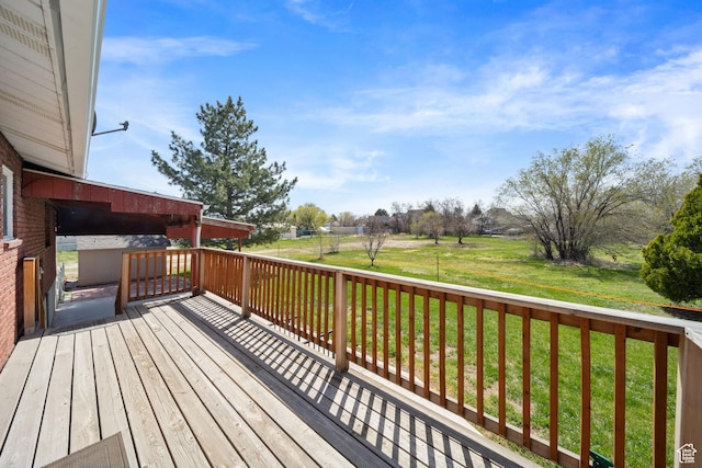 wooden deck with a lawn