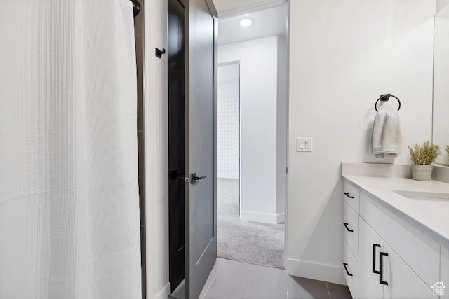 full bathroom with vanity, recessed lighting, a shower with shower curtain, tile patterned floors, and baseboards