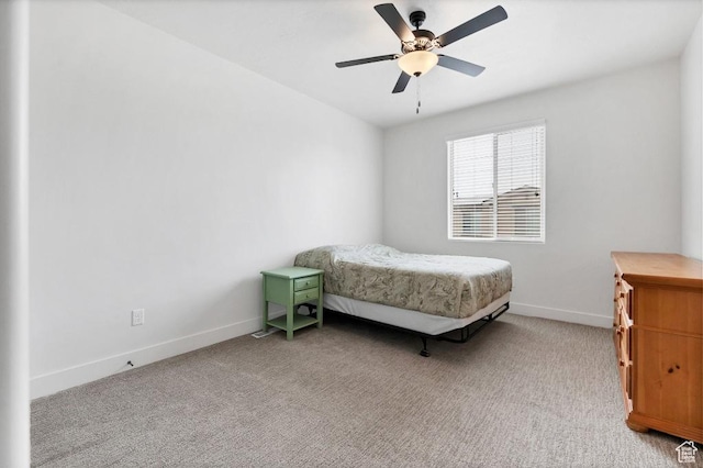 bedroom with baseboards, ceiling fan, and carpet