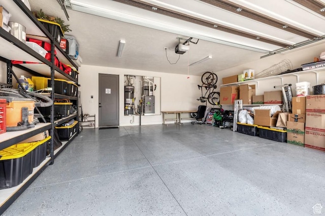 garage with water heater and a garage door opener