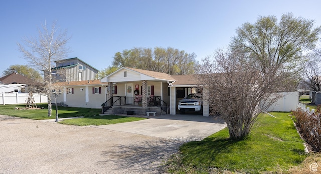 145 S 100 E, Redmond, UT 84652 - view of front of house featuring covered porch, driveway, fence, and a front lawn