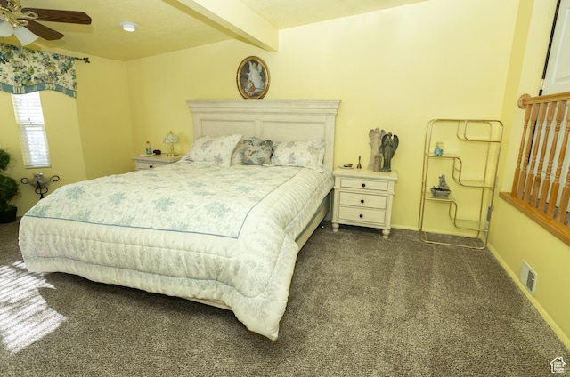 145 S 100 E, Redmond, UT 84652 - bedroom with beamed ceiling, dark carpet, a ceiling fan, visible vents, and baseboards