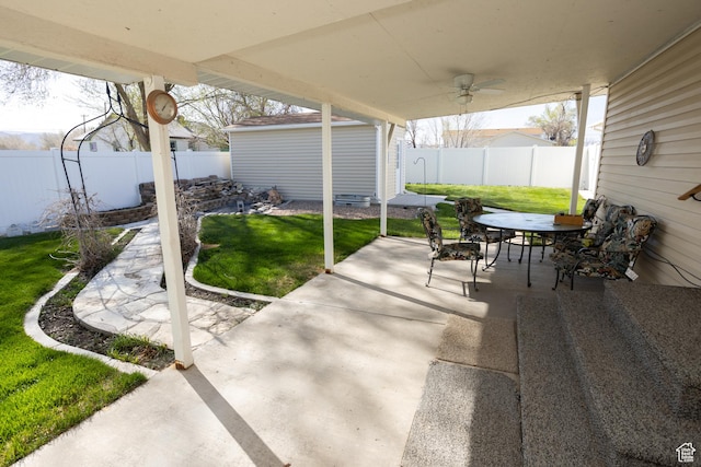 145 S 100 E, Redmond, UT 84652 - view of patio / terrace with an outbuilding, a fenced backyard, outdoor dining space, and a storage shed