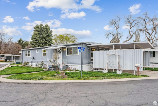 5100 S 1050 W Unit H138, Riverdale, UT 84405 - manufactured / mobile home featuring a front yard