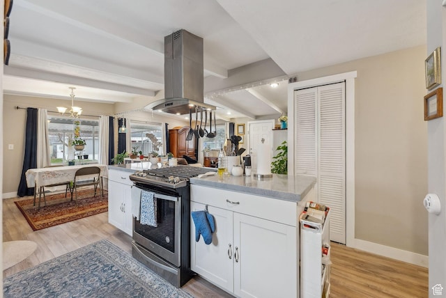 5100 S 1050 W Unit H138, Riverdale, UT 84405 - kitchen with island range hood, baseboards, gas stove, and light wood-style flooring