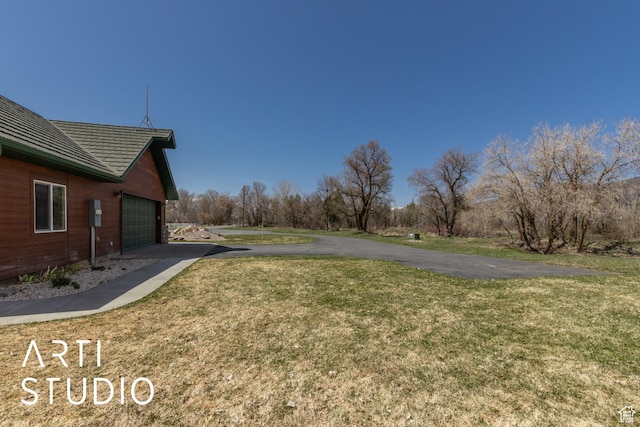 260 S 10450 E, Huntsville, UT 84317 - view of yard with driveway and a garage