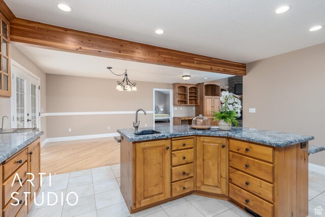 260 S 10450 E, Huntsville, UT 84317 - kitchen with recessed lighting, glass insert cabinets, a sink, and dark stone countertops