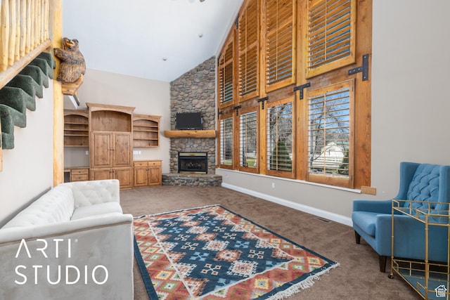 260 S 10450 E, Huntsville, UT 84317 - carpeted living area featuring baseboards, a towering ceiling, and a stone fireplace