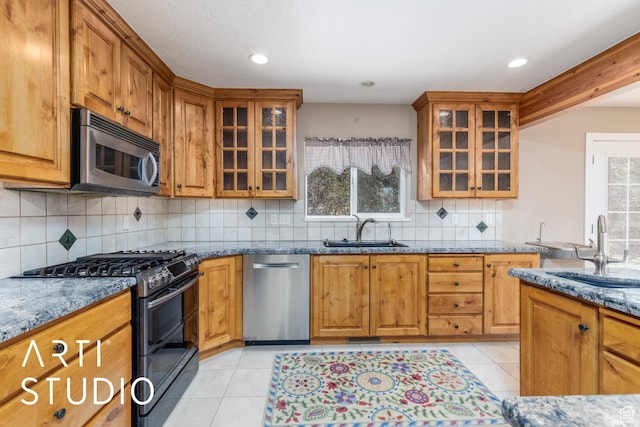 260 S 10450 E, Huntsville, UT 84317 - kitchen featuring stone countertops, light tile patterned floors, a sink, and appliances with stainless steel finishes