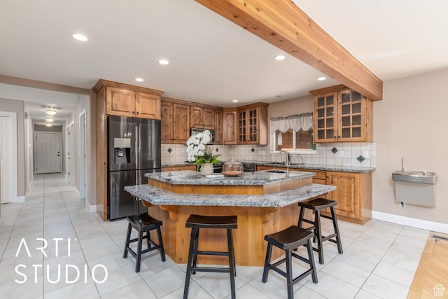 260 S 10450 E, Huntsville, UT 84317 - kitchen featuring brown cabinetry, appliances with stainless steel finishes, an island with sink, and recessed lighting