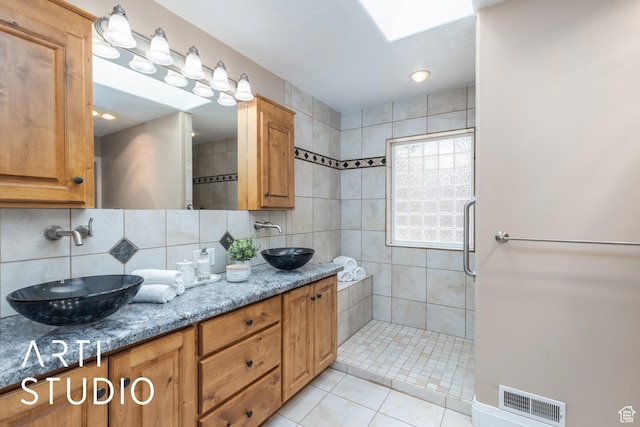 260 S 10450 E, Huntsville, UT 84317 - full bathroom featuring a sink, visible vents, tasteful backsplash, and tiled shower