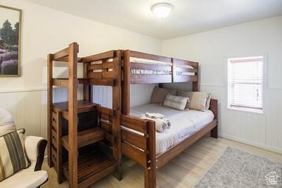 48 E 2nd N, Manila, UT 84046 - bedroom featuring a wainscoted wall and wood finished floors