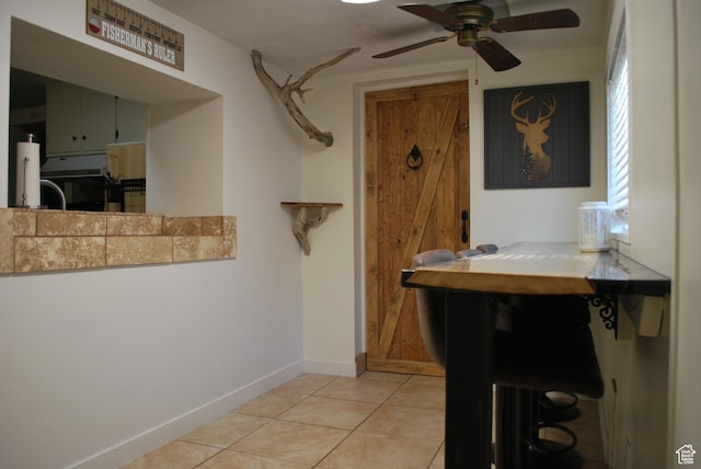 48 E 2nd N, Manila, UT 84046 - interior space with light tile patterned floors, ceiling fan, and baseboards