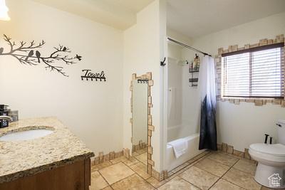 48 E 2nd N, Manila, UT 84046 - full bathroom featuring toilet, vanity, and shower / tub combo with curtain