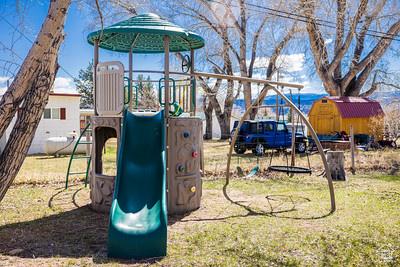 48 E 2nd N, Manila, UT 84046 - view of jungle gym featuring a lawn