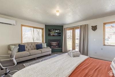 48 E 2nd N, Manila, UT 84046 - living room with a wall mounted air conditioner, a fireplace, and baseboards