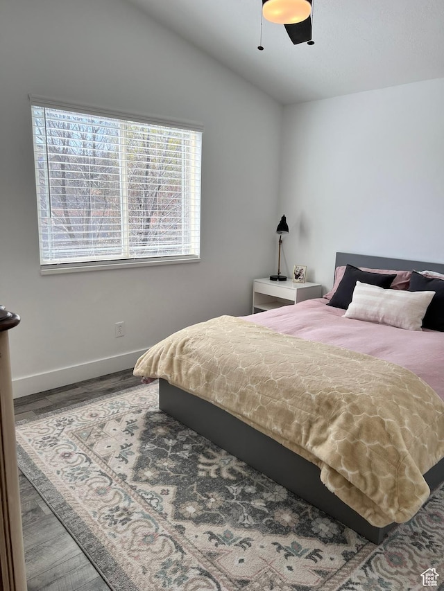 7777 N Mountain Ash Way, Eagle Mountain, UT 84005 - bedroom featuring baseboards, a ceiling fan, wood finished floors, and lofted ceiling