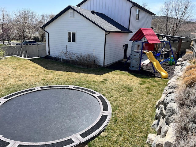 7777 N Mountain Ash Way, Eagle Mountain, UT 84005 - back of house featuring fence, a playground, and a lawn