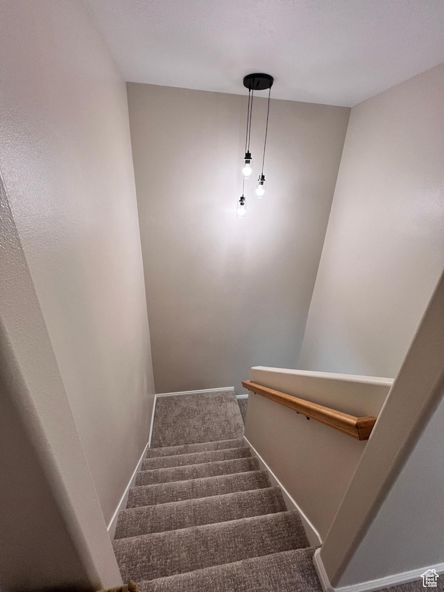 7777 N Mountain Ash Way, Eagle Mountain, UT 84005 - staircase featuring baseboards and carpet