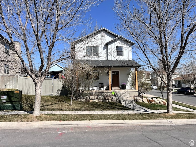 7777 N Mountain Ash Way, Eagle Mountain, UT 84005 - view of front of home featuring a porch, fence, and a gate