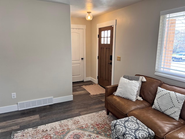 7777 N Mountain Ash Way, Eagle Mountain, UT 84005 - living room with visible vents, baseboards, and wood finished floors