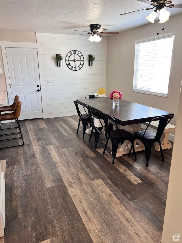 7777 N Mountain Ash Way, Eagle Mountain, UT 84005 - dining room featuring a textured ceiling, a ceiling fan, and dark wood finished floors