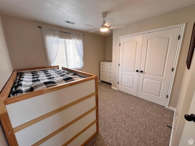 7777 N Mountain Ash Way, Eagle Mountain, UT 84005 - bedroom featuring a closet, baseboards, a ceiling fan, visible vents, and light colored carpet