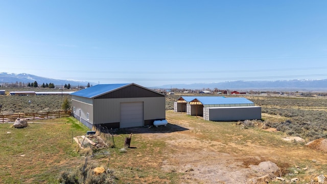 19185 N 11250 E, Mount Pleasant, UT 84647 - view of pole building with a mountain view, fence, and dirt driveway