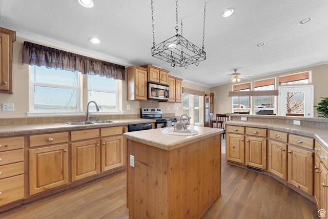 19185 N 11250 E, Mount Pleasant, UT 84647 - kitchen featuring a sink, appliances with stainless steel finishes, a kitchen island, and light wood-style floors