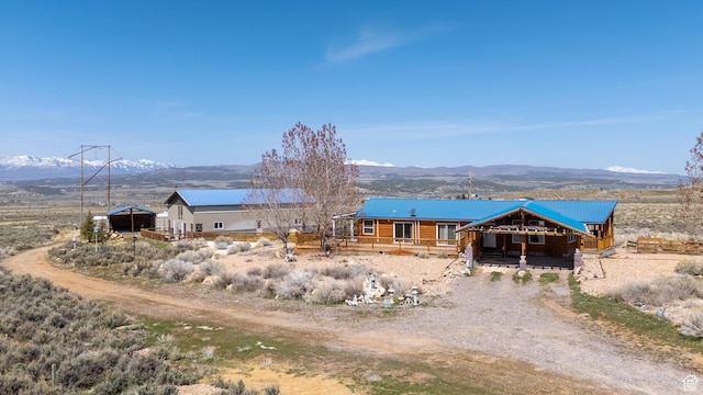 19185 N 11250 E, Mount Pleasant, UT 84647 - exterior space featuring a mountain view, an outdoor structure, driveway, and an exterior structure