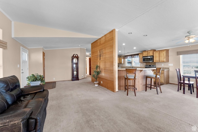 19185 N 11250 E, Mount Pleasant, UT 84647 - living room with vaulted ceiling, recessed lighting, crown molding, ceiling fan, and light colored carpet