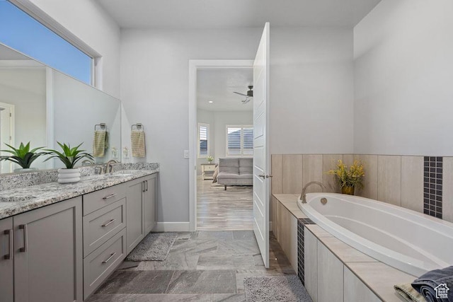 1976 E 1200th Cir N, St George, UT 84770 - full bathroom with vanity, baseboards, a bath, and a ceiling fan