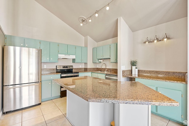 kitchen featuring a sink, stainless steel appliances, light tile patterned floors, under cabinet range hood, and a kitchen island