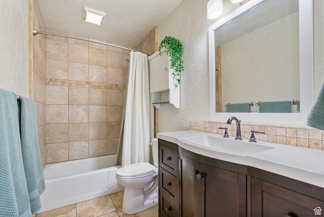 bathroom featuring vanity, tile patterned flooring, a textured wall, toilet, and shower / bathtub combination with curtain