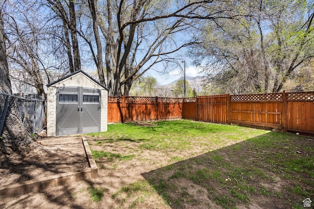 486 13th St, Ogden, UT 84404 - view of yard featuring a storage shed, an outbuilding, and a fenced backyard