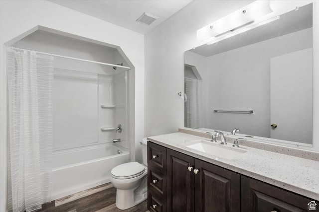 486 13th St, Ogden, UT 84404 - full bathroom featuring visible vents, shower / bath combination with curtain, toilet, vanity, and wood finished floors