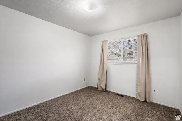486 13th St, Ogden, UT 84404 - empty room featuring visible vents, a textured ceiling, baseboards, and carpet floors
