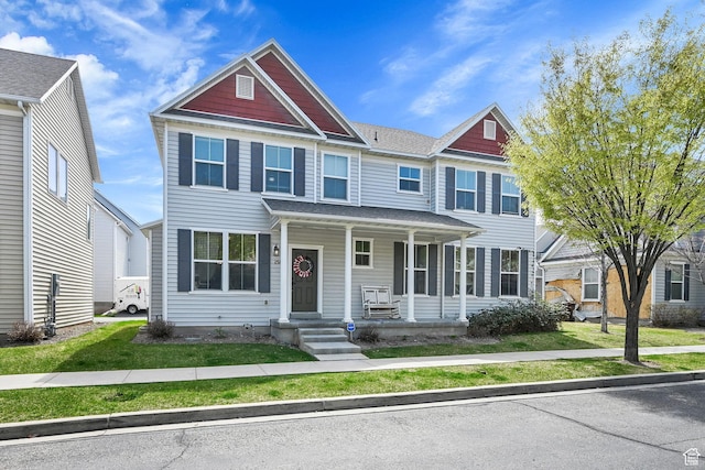 townhome / multi-family property featuring a porch