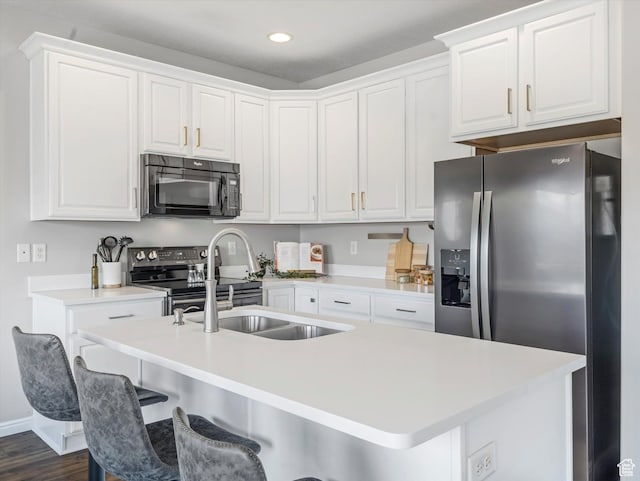 14939 S Winged Bluff Ln, Draper, UT 84020 - kitchen with appliances with stainless steel finishes, a sink, white cabinetry, and recessed lighting