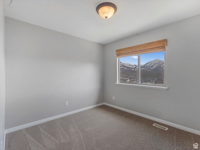 14939 S Winged Bluff Ln, Draper, UT 84020 - unfurnished room with carpet floors, baseboards, and a mountain view